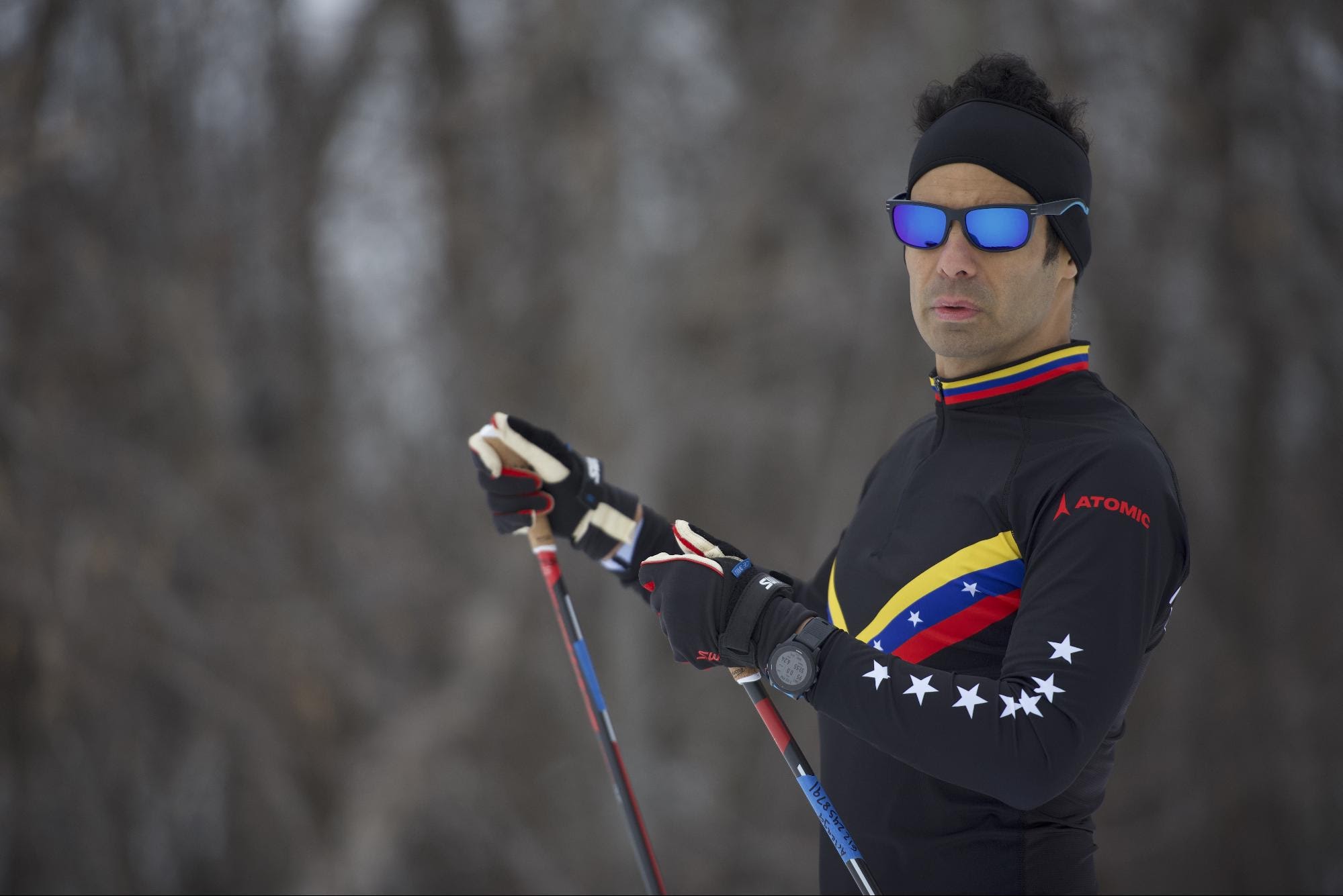 Eduardo Arteaga wearing black ski outfit with Venezuela flag print